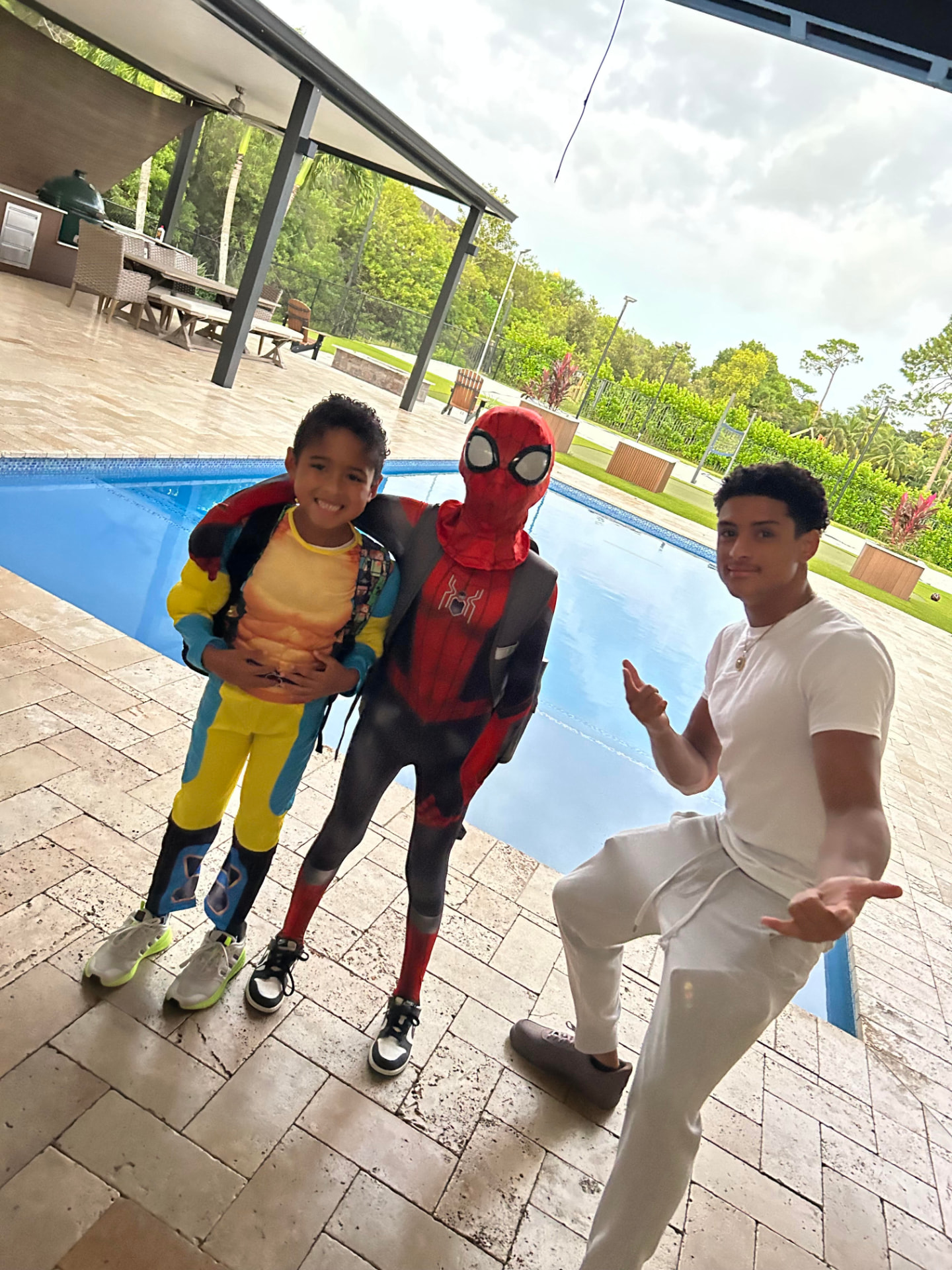 Xander Black by the pool with kids